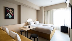A hotel room with two beds, a small table, and a sofa. - Section L Yushima - Ueno (Tokyo)