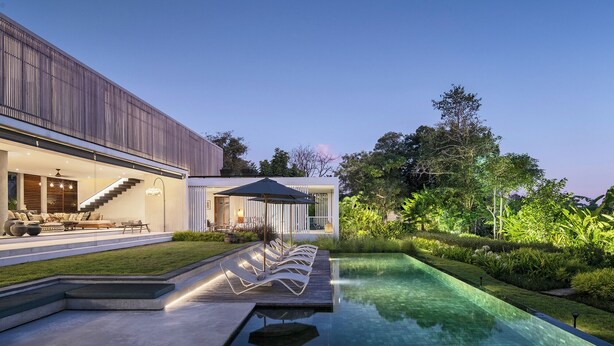 A modern house with a swimming pool, outdoor seating, and a well-maintained garden. - La Maison d'Ulysse  (Kerobokan)