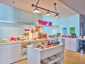 A breakfast buffet area with various food stations, including yogurt, cereal, and a bakery section. - Tru by Hilton Can Tho Cai Khe (Can Tho)