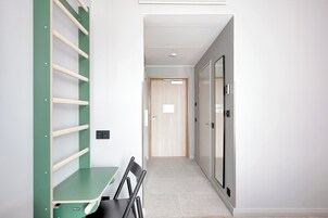 Standard Quadruple Room | Laptop workspace, blackout drapes, iron/ironing board