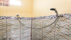 A shower with a handheld showerhead and a flexible hose. - OYO Life 90433 Serasi Kost (Palembang)