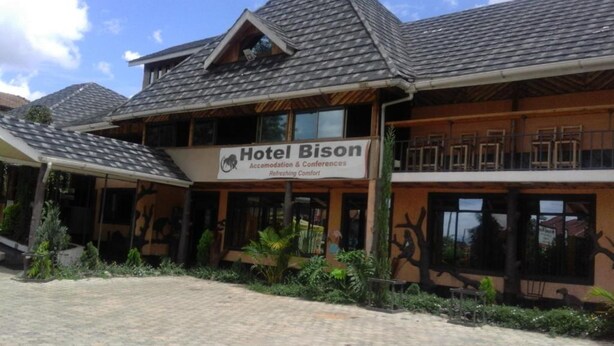 A hotel named Hotel Bison with a sign indicating it offers accommodation and conferences. - Hotel Bison (Nakuru)