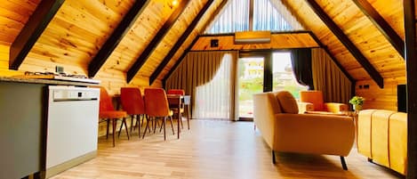 Garden Bungalow | Living area | 50-inch Smart TV with satellite channels