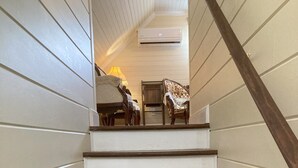 A staircase with wooden steps and white walls. - Early1880s farmhouse in rural Eastern Kentucky Appalachia. (Booneville)