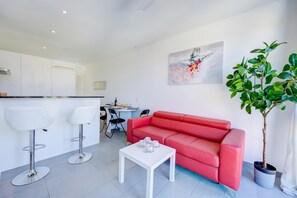 Standard Apartment, Multiple Bedrooms, Mountainside (Residenza Castello) | Living area | 21-inch TV with cable channels