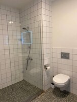 Rainfall showerhead, designer toiletries, hair dryer, towels