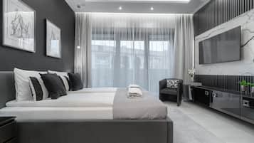 Tabla de planchar con plancha, cunas, wifi gratis y ropa de cama