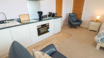 Fridge, electric kettle, cookware/dishes/utensils