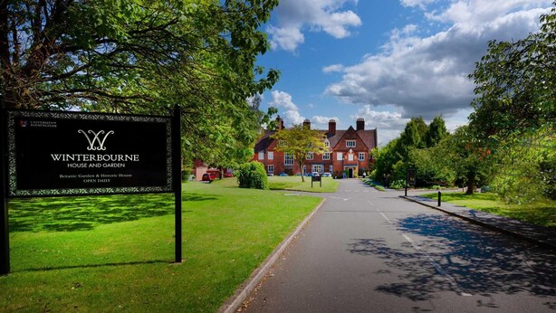 A sign for Winterbourne House and Garden, a botanic garden and historic house open daily.