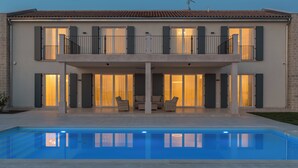 A two-story house with a swimming pool in the foreground. - Villa Villa Borgonja (Istria - Brtonigla) (Brtonigla)