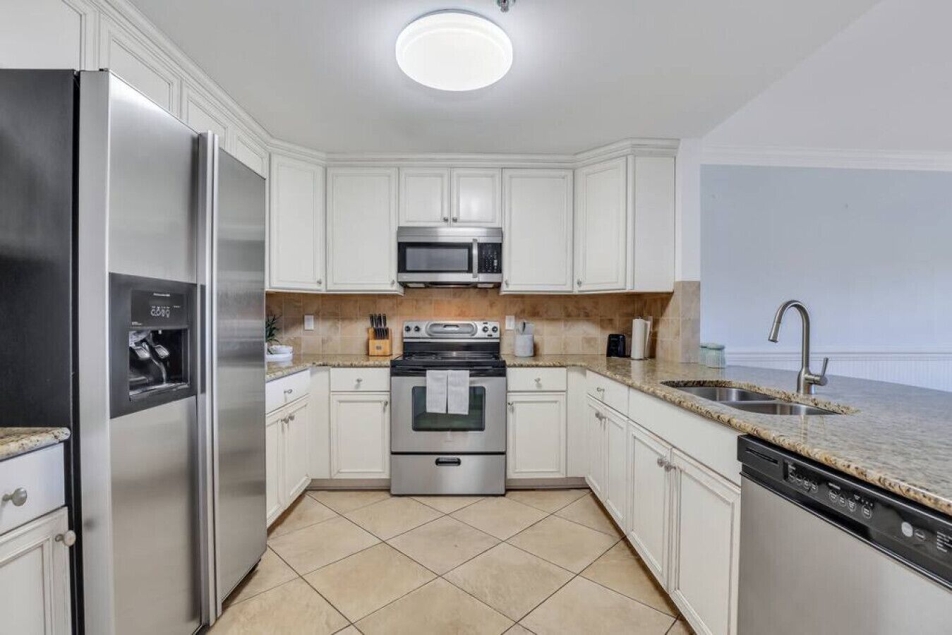 Fridge, stovetop, dishwasher, coffee/tea maker