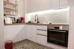 Full-sized fridge, oven, toaster, mixer