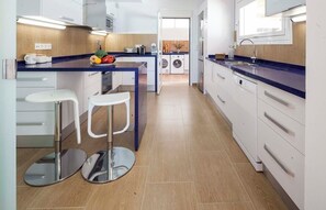 Private kitchen - CAN PARRAS: Family home with a pool and barbecue, 3-minute walk from the beach (Sant Josep de sa Talaia)