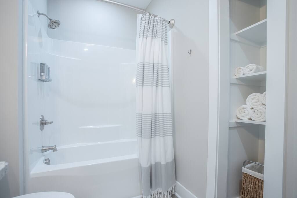 Bathtub, hair dryer, towels