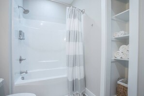 Bathtub, hair dryer, towels