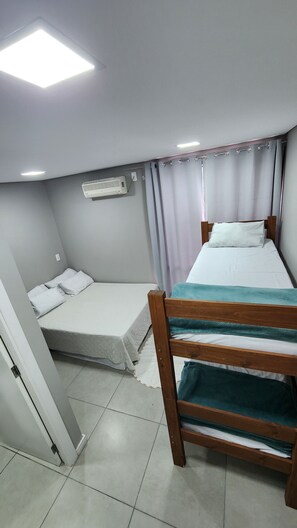 Family Room, Private Bathroom | Iron/ironing board, free WiFi, bed sheets - Espaço 386 (Blumenau)