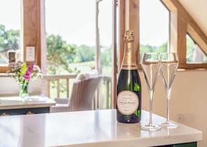 Enjoy a celebratory moment with a view of lush greenery from the large window.