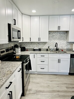 Fridge, oven, stovetop - Welcome to Mindelo Oasis, your Florida pool house vacation home! (Brandon)