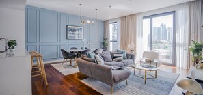 Premier Apartment, 2 Bedrooms | Living area | 55-inch Smart TV with cable channels, TV, Netflix