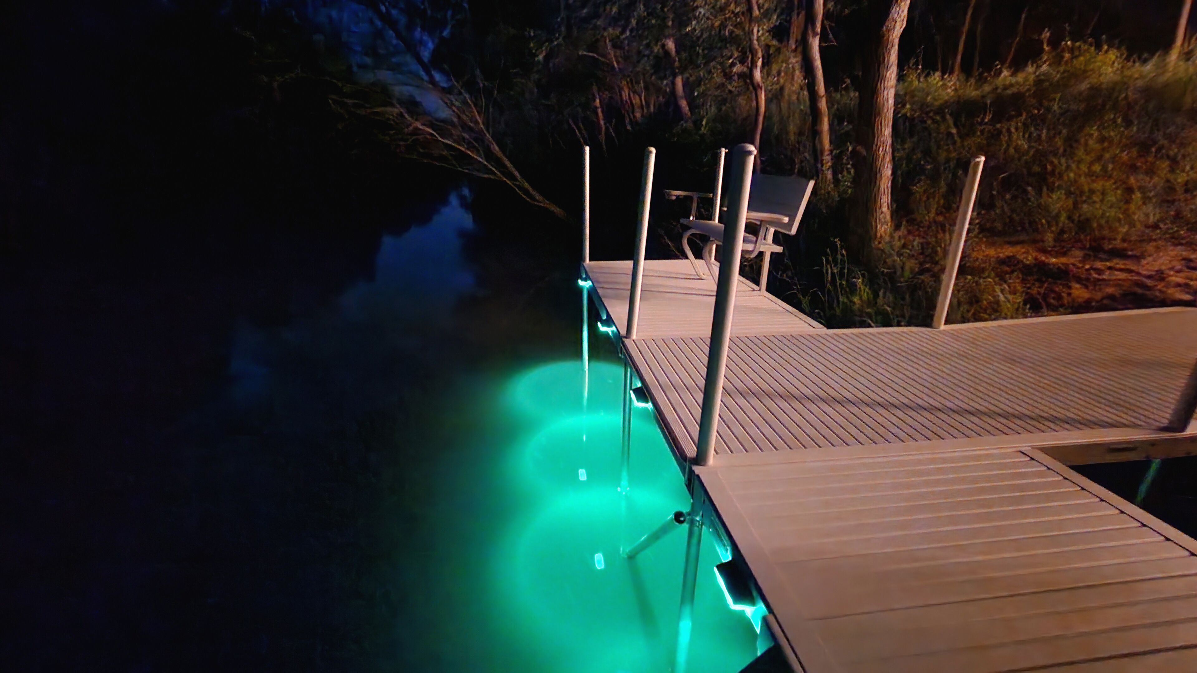 Tranquil river dock: cozy bench, gentle light.