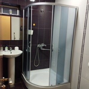 Design Apartment | Bathroom | Shower, hair dryer, slippers, towels