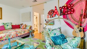 A vibrant room with a bed, a hanging chair, and a guitar. - Contemporary Home - 1 Mi to Georgetown Square (Georgetown)
