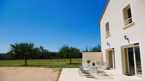 Guests can enjoy a peaceful stay in this single-story building with a balcony and easy access to the surrounding lawn.
