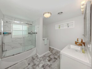 Shower, hair dryer, towels, soap