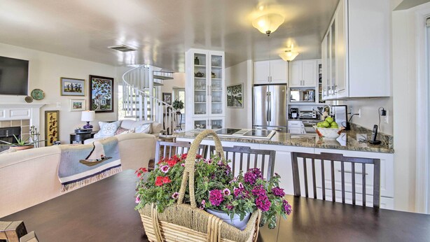 A modern kitchen with white cabinets, a built-in oven, and a stainless steel refrigerator. - Luxe Chesapeake Bay Getaway < 20 Mi to Annapolis! (Shady Side)