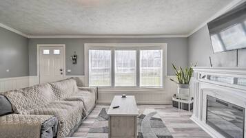 Cottage (3 Bedrooms) | Living area | TV, fireplace