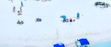 On the beach, sun-loungers, beach towels