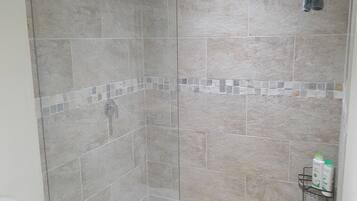 Shower, hair dryer, towels, shampoo