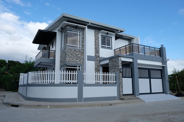 The immaculate 4 bedroom house with 3 full bathrooms, 2 balconies + gated garage