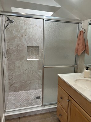 Shower, hair dryer, towels, soap