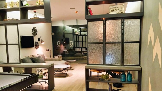 A modern living room with a pool table, comfortable seating, and a glass coffee table. - Two Beautiful 1 BR apts, 2 floors apart HS WiFi, full amenities! (Ciudad de México)