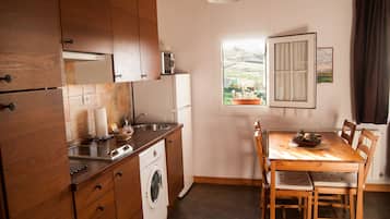 Apartment | Private kitchen | Full-sized fridge, microwave, stovetop, coffee/tea maker