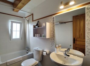Apartment | Bathroom | Bathtub, hair dryer, towels, soap - Apartamentos Corona (Comillas)