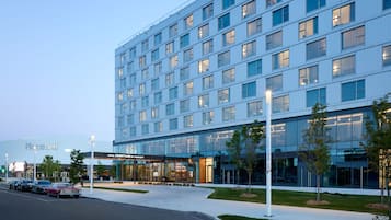 Place Bell hotel offers a sleek, modern exterior with a glass facade and a prominent entrance.