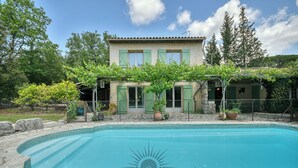 A two-story house with a swimming pool in front. - SERENITY Villa for 8 By Sunset (Grasse)