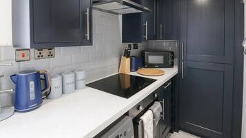 Appartamento, letti multipli | Cucina privata | Frigorifero, microonde, forno, piano cottura