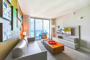 Luxury Condo, 2 Bedrooms, Partial Ocean View | Living area | 60-inch Smart TV with cable channels, TV