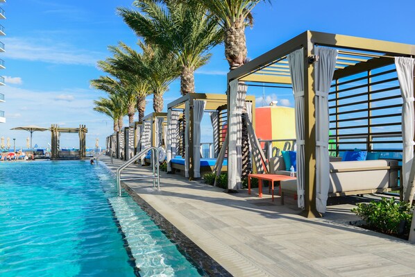 2 outdoor pools, open 7:30 AM to 6:30 PM, free cabanas, pool umbrellas