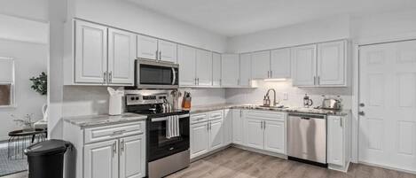 Fridge, microwave, stovetop, coffee/tea maker