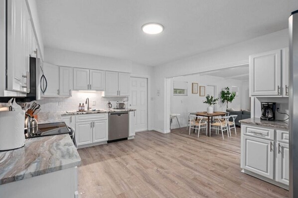 Fridge, microwave, stovetop, coffee/tea maker
