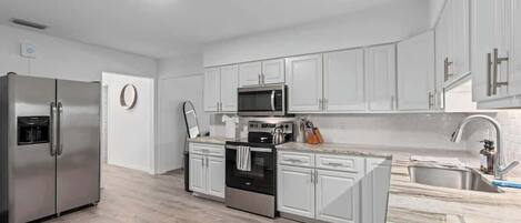 Fridge, microwave, stovetop, coffee/tea maker