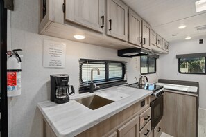 Fridge, microwave, stovetop, coffee/tea maker
