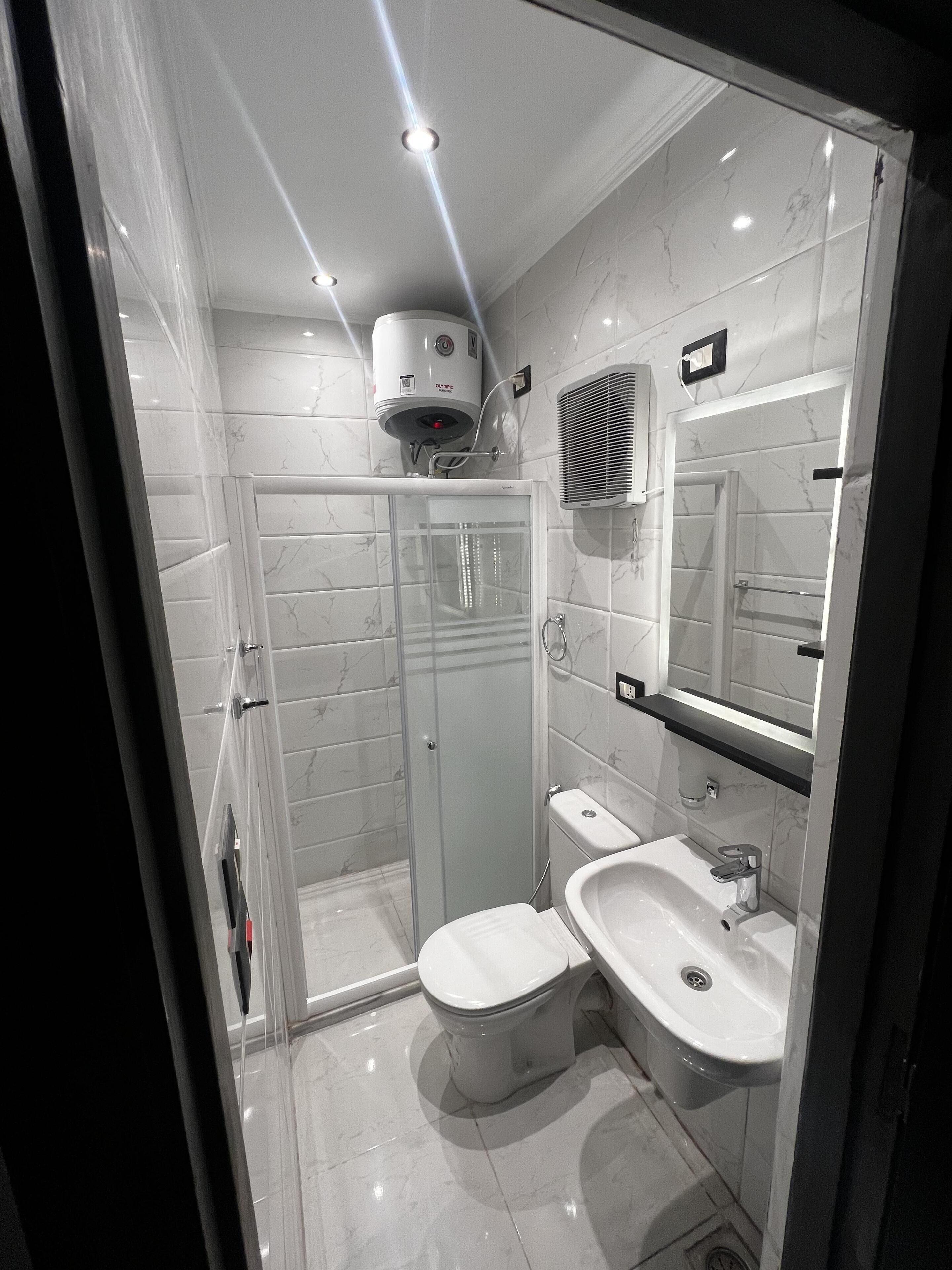 shower, rainfall showerhead, towels