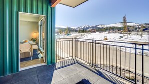 A balcony with a view of a snowy mountain landscape. - Modern Winter Park Condo w/ Community Hot Tub! (Winter Park)