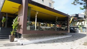 A building with a yellow awning and a sign that reads "DonAlfonso." - Modern 2 bedroom Vilamoura Marin (Quarteira)