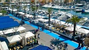 A marina with boats, outdoor seating, and a pool area. - Modern 2 bedroom Vilamoura Marin (Quarteira)